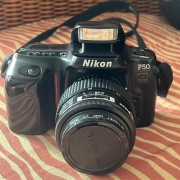 Nikon f50-35-70 lens with a normal use battery storage bag