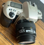Nikon F60 film camera with 28-80mm lens and battery charger